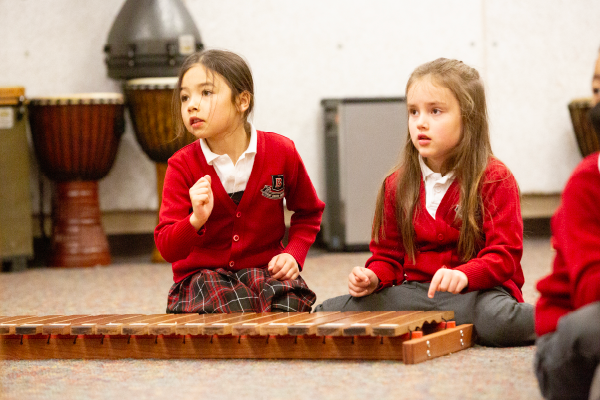 Junior School students learning how to communicate through music